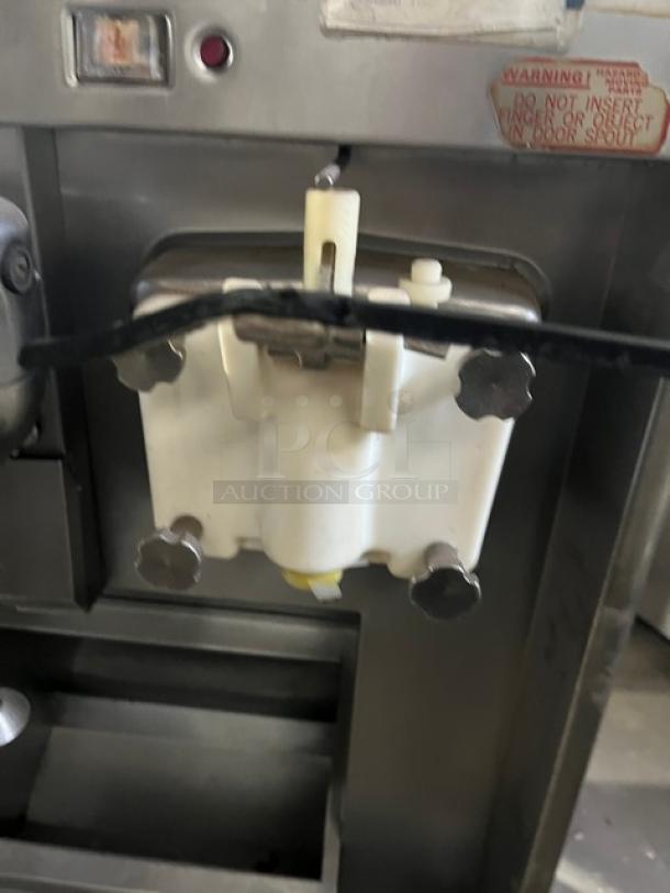 Taylor Model 632-33 ice cream/frozen yogurt machine, stainless steel, dual shake, spinner head mixer, 208/230V, on casters.