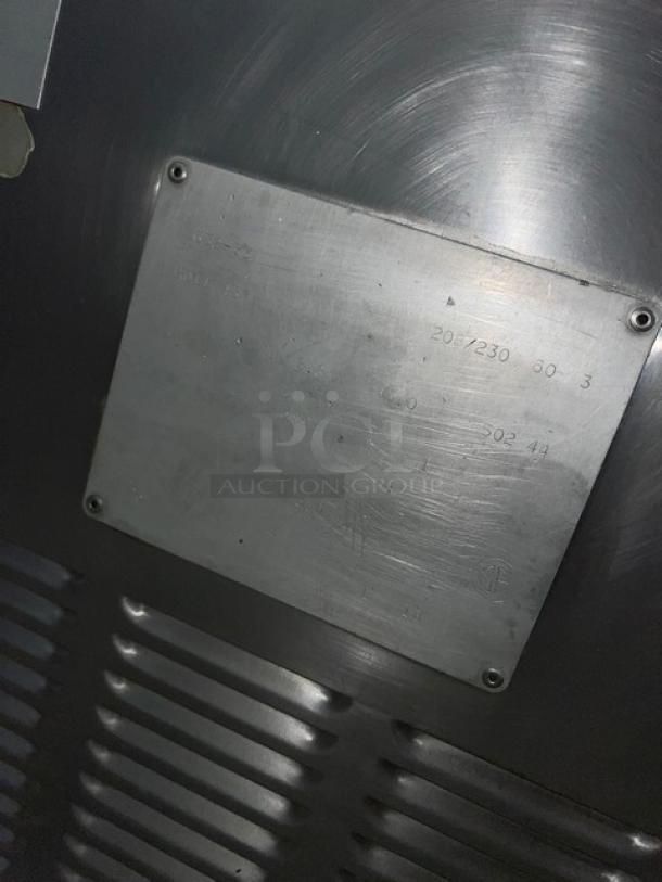 Taylor 632-33 commercial stainless steel dual shake and soft serve freezer, electric-powered, model and voltage plate visible.