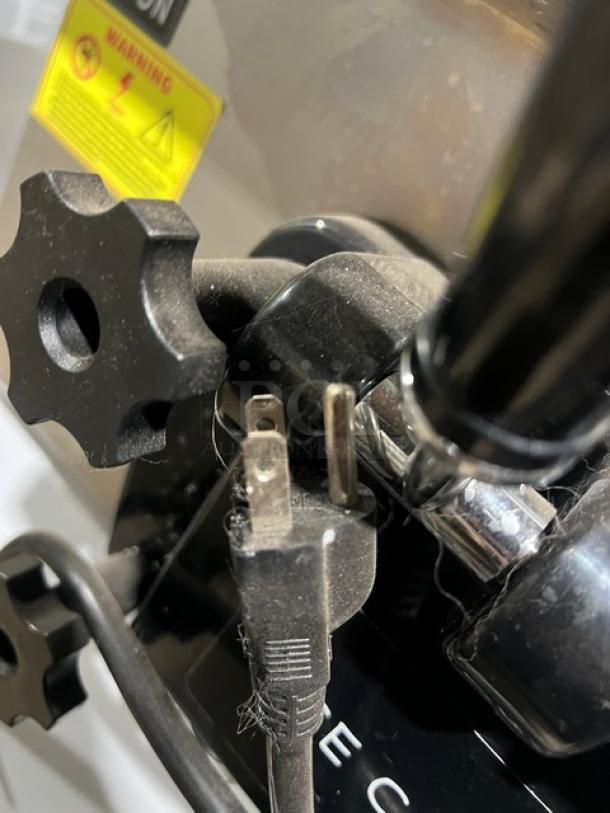 Commercial stainless steel ice cream machine, Model XY-25L, electric-powered. Features dual twist dispensers, plug, and warning label.