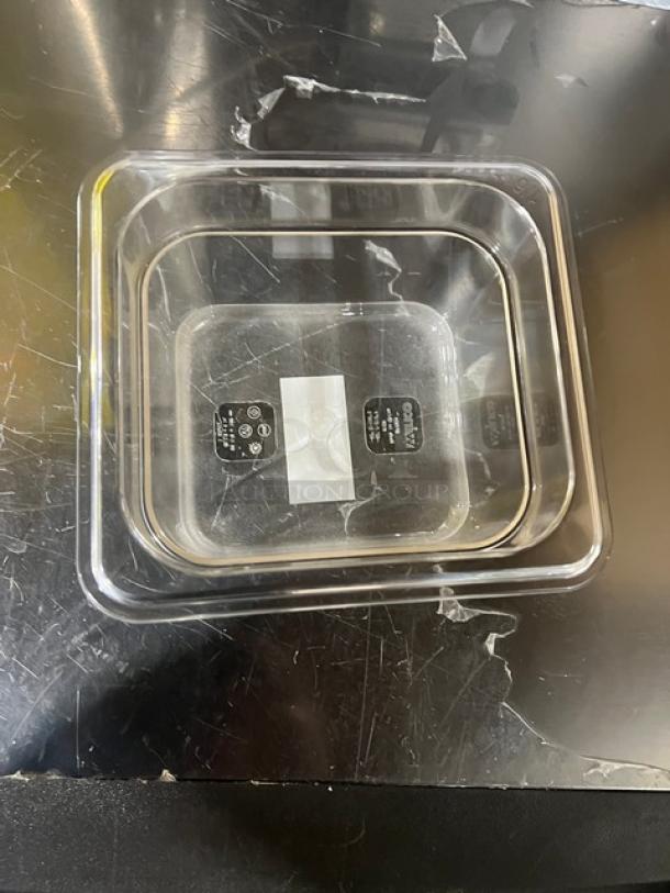 Winco SP7604 clear polycarbonate 1/6-size food pan, 4" deep, new condition, with visible product labels.