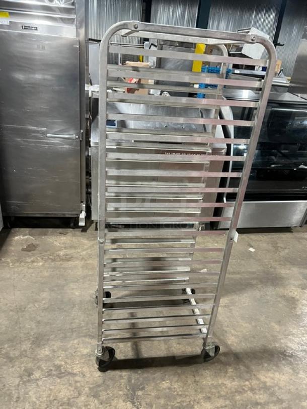 Commercial aluminum full-height bun/sheet pan rack on casters. Features multiple shelves, sturdy design, and smooth mobility.
