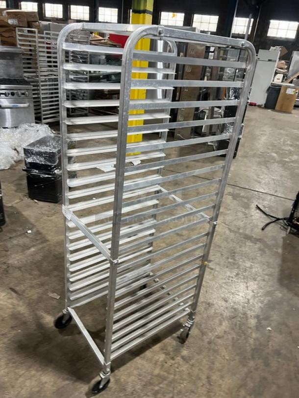 Commercial aluminum full-height bun/sheet pan rack on casters, 20 slots, durable frame, good condition, industrial use.