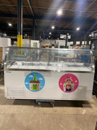 Global Baskin Robbins-style ice cream dipping cabinet with sneeze guard, dual rear access doors, covers, and tub holders.