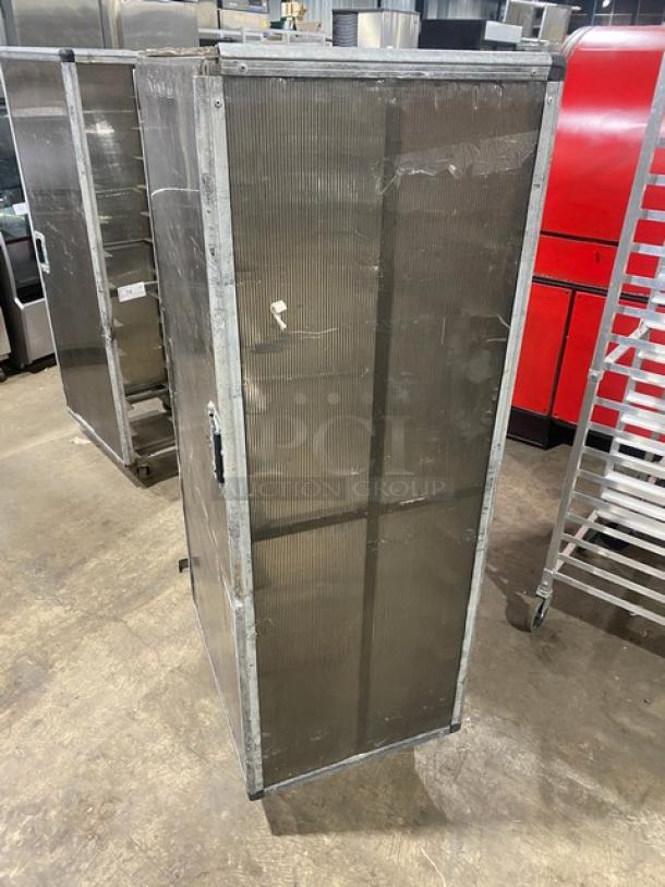 Commercial aluminum full-height bun/sheet pan rack with corrugated sidewalls, on casters, durable condition.