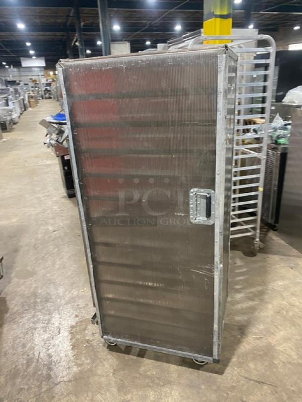 Commercial aluminum full-height bun/sheet pan rack with corrugated sidewalls, on casters, used condition.