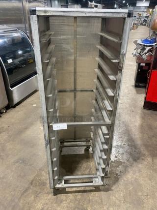 Commercial full-height aluminum bun pan rack with corrugated sidewalls, on casters, used condition.