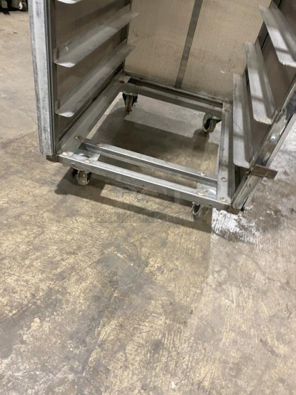 Commercial aluminum full-height sheet pan rack with corrugated sidewalls, on casters, in used condition.