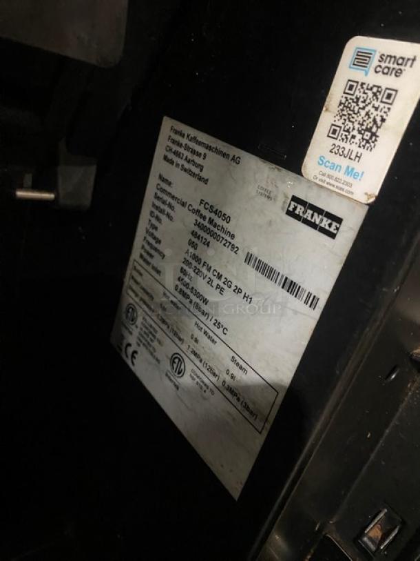 Franke FCS4050 commercial coffee machine label, black electric countertop model, with QR code and voltage details.