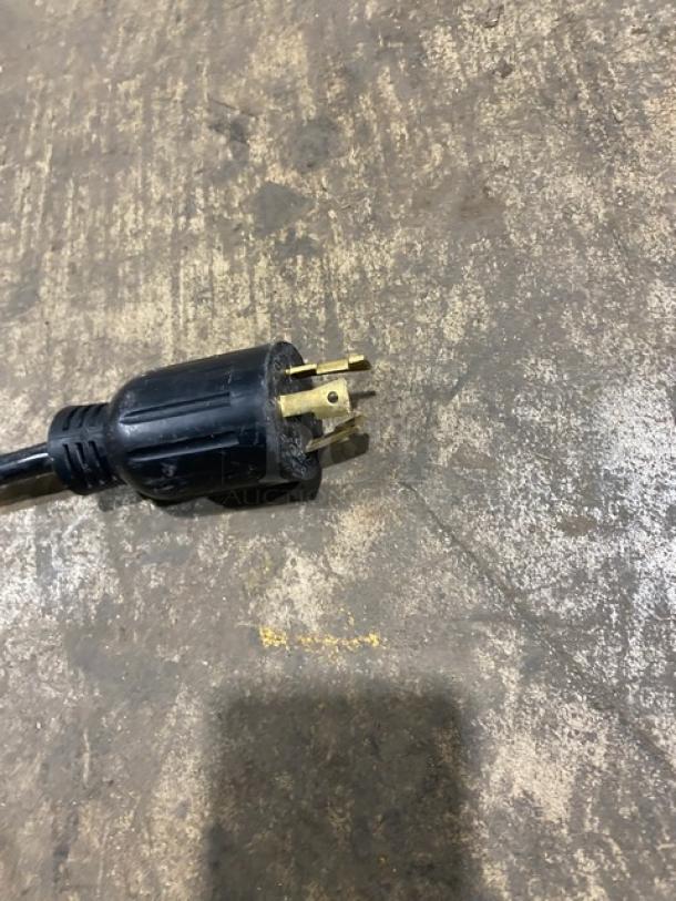 Franke FCS4050 commercial coffee machine power plug on a concrete floor.