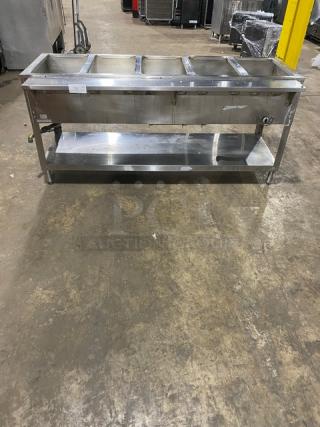 Duke Aerohot 5-well stainless steel gas steam table, single undershelf, on legs; ideal for commercial use.