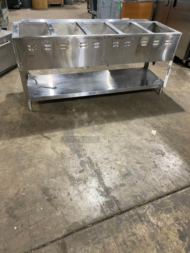 Duke Aerohot Series 5-well stainless steel hot food/steam table, gas-powered, with single undershelf, on legs, used.