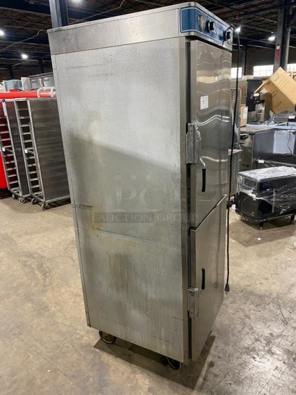 Alto-Shaam Halo Heat commercial stainless steel Dutch door dual-compartment heated cabinet with individual controls and rack, on casters.