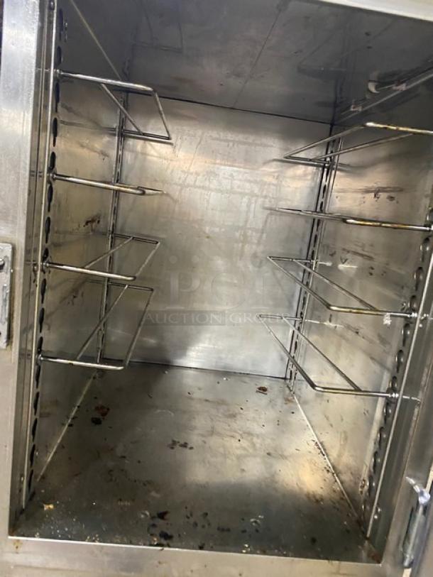 Alto-Shaam Halo Heat stainless steel heated cabinet, dual-compartment, solid Dutch doors, built-in rack, on casters.