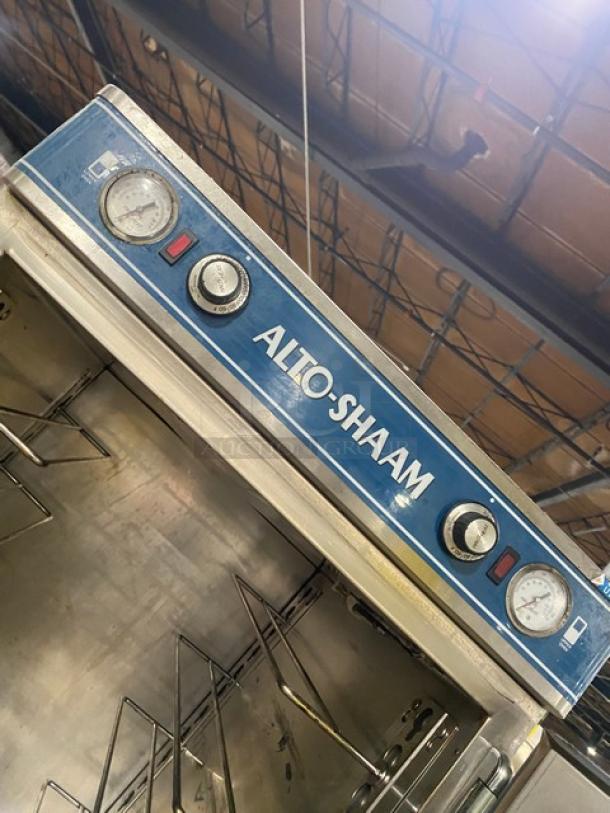 Alto-Shaam Halo Heat commercial stainless steel dual-compartment heated holding cabinet with individual control and wired rack on casters.