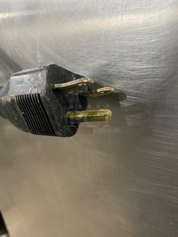 Alto-Shaam Halo Heat commercial stainless steel cabinet plug close-up, showing minimal wear, suitable for heated holding.