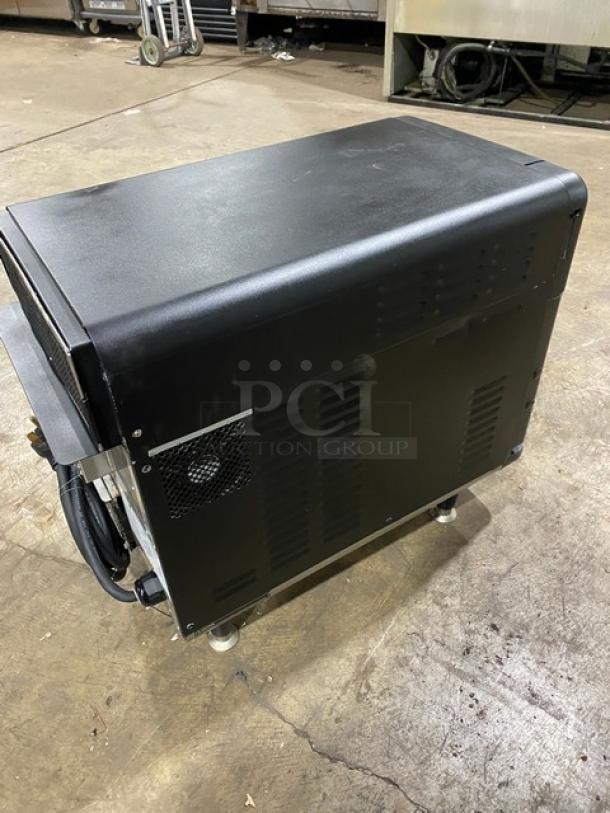 TurboChef NGO ventless rapid cook oven, 2021 model, black, electric, countertop, crank bar, on legs, for commercial use.