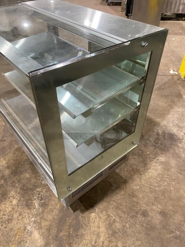 Kinco CNZ90CM stainless steel bakery display case, multi-tier, straight-glass, double sliding doors, on casters, 110V.