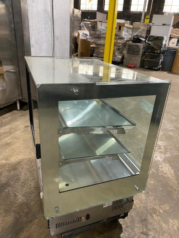 Kinco CNZ-90CM refrigerated bakery display case, stainless steel, straight-glass, multi-tier, with rear glass sliding doors, on casters.