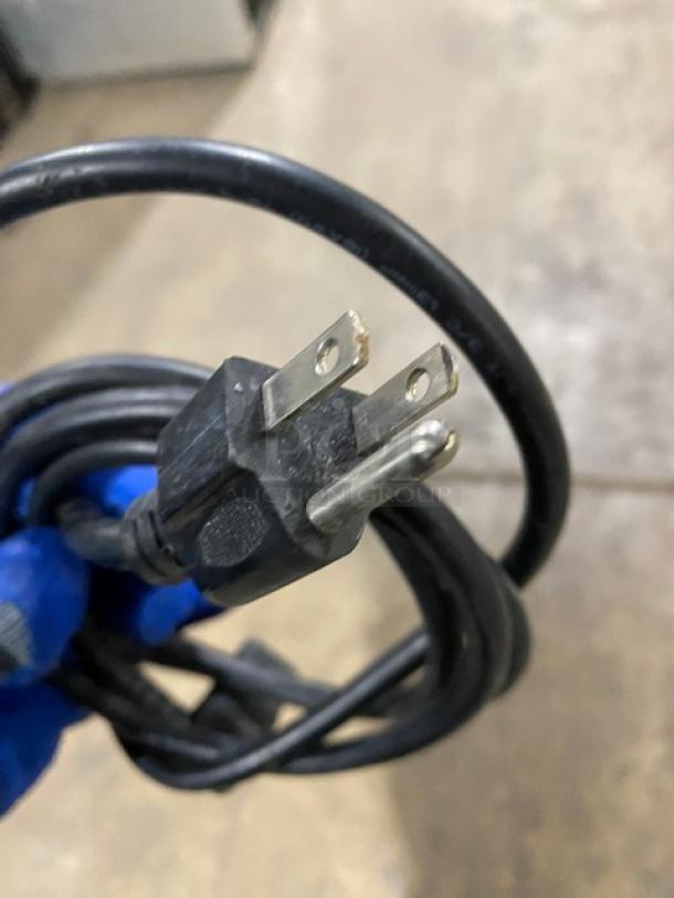 Power cord for Kinco CNZ-90CM refrigerated bakery display case, showing standard 110V plug.