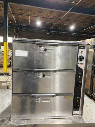APW Wyott Model HDD3 stainless steel 3-compartment warming drawer, with individual controls, shown in good condition.