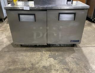 True TUC-60 stainless steel undercounter refrigerator, 2 doors, 60" worktop, on casters, excellent condition.