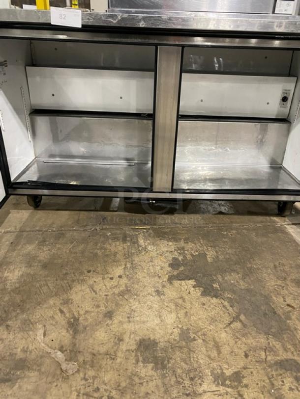 True TUC-60 undercounter refrigerator, stainless steel, dual-door, on casters, spacious interior, commercial-grade.