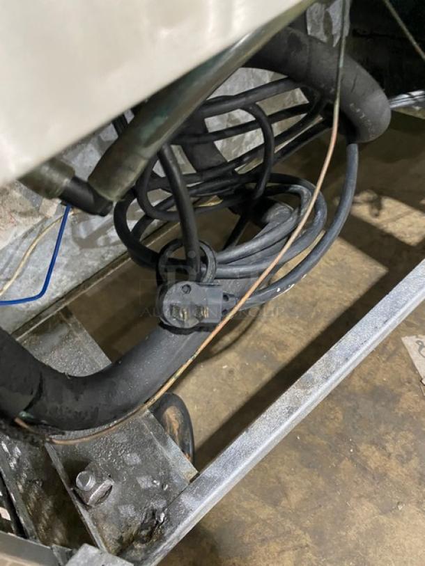 True Commercial Stainless Steel Undercounter Refrigerator, Model TUC-60, features visible wiring and refrigeration components.