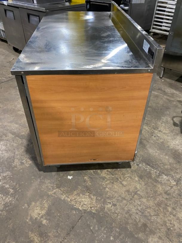 Duke Commercial 2-door stainless steel worktop refrigerator, Model RBC-60M, with up-turned backsplash, on legs, 120V, good condition.