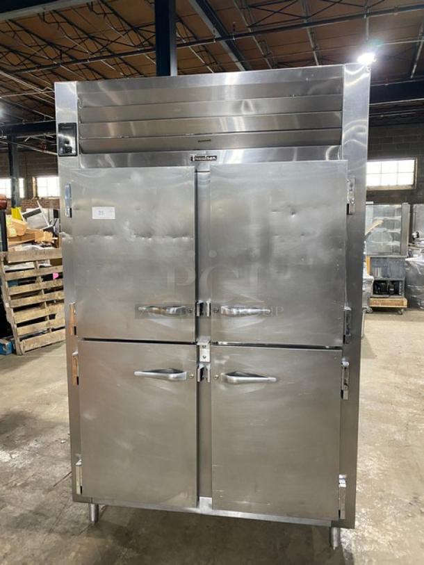 Traulsen AHT232NUT stainless steel 4-door reach-in refrigerator with built-in pan slides, model no. 2277915K, on legs.