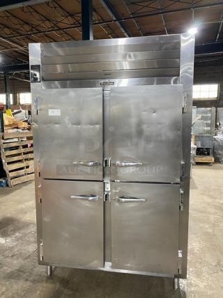 Traulsen AHT232NUT stainless steel 4-door reach-in refrigerator with built-in pan slides, model no. 2277915K, on legs.
