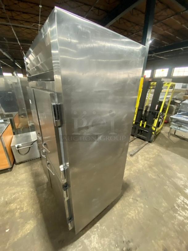 Traulsen AHT232NUT commercial stainless steel 4-door refrigerator with built-in pan slides, on legs, pre-owned condition.