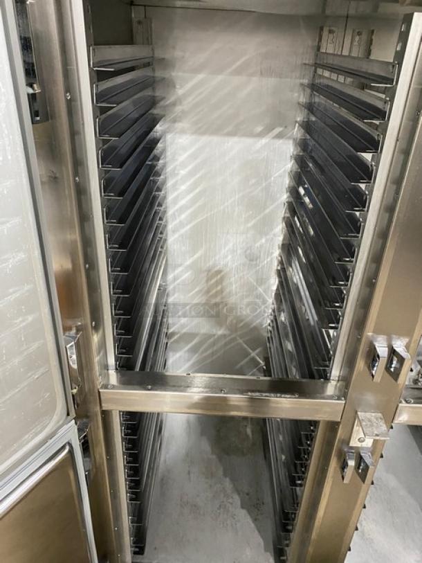 Traulsen stainless steel 4-door reach-in refrigerator, model AHT232NUT, features built-in pan slides and secure door handles.