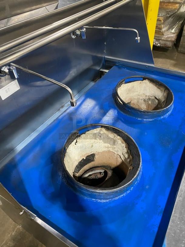 Commercial stainless steel 2-burner Chinese wok range with backsplash, dual swivel spout faucet, and sturdy legs.