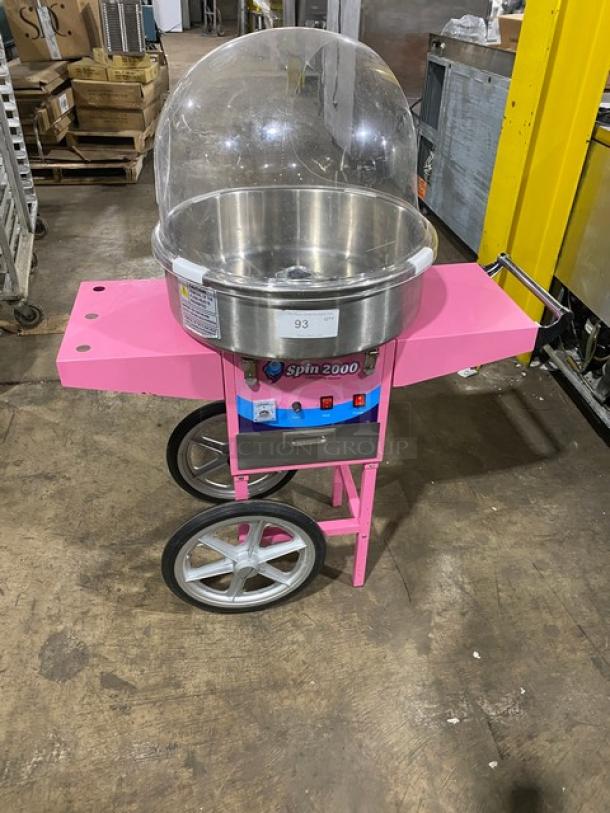 Olde Midway Spin-2000 pink cotton candy machine with 20" stainless bowl and clear dome, on wheels. Model: CON-COT-SP2000-CRT.