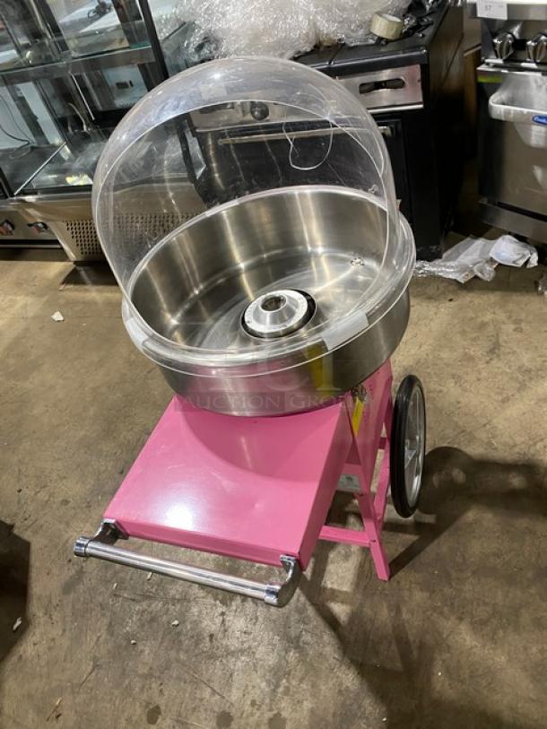 Olde Midway Spin-2000 hot-pink electric cotton candy machine with stainless 20" bowl, clear dome lid, wheels, and legs.