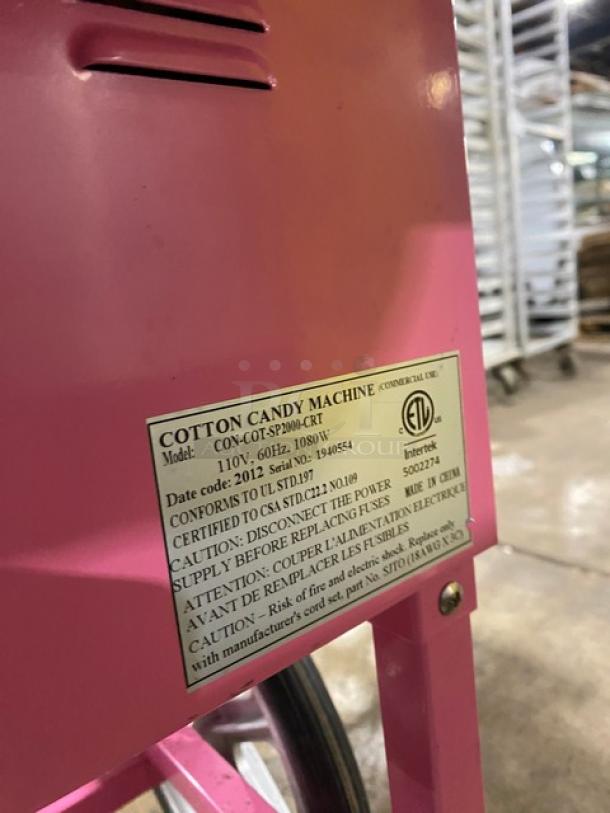 Olde Midway Spin-2000 cotton candy machine with stainless steel bowl, clear dome lid, and wheels. Model: CON-COT-SP2000-CRT.