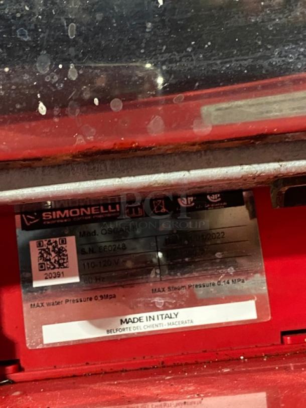 Nuova Simonelli Oscar II espresso machine, red stainless steel, 2022 model, shows serial number 660248, voltage 110-120V.