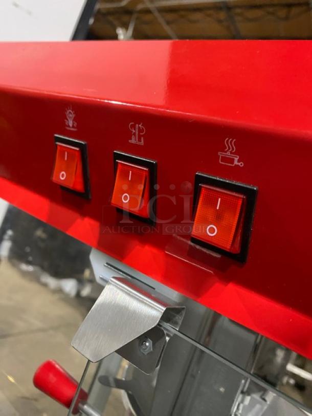 Carnival King red stainless steel popcorn machine, with control switches; shows durable design and stainless steel detail.