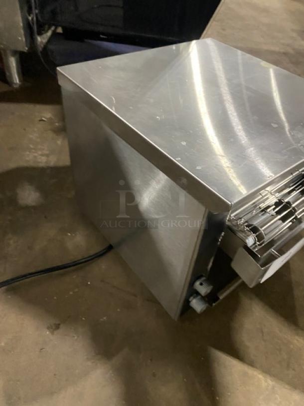 Vollrath JT1 stainless steel electric countertop conveyor toaster, 120V, on legs, in used condition.