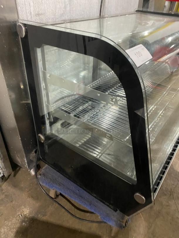 Marchia Model MDC161 stainless steel 36" curved glass bakery display case with adjustable chrome rack and LED lighting.
