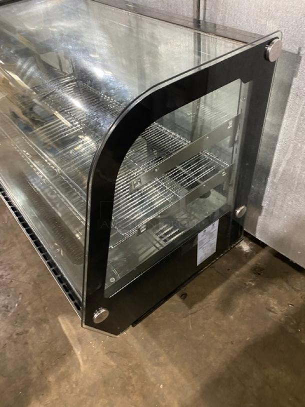 Marchia MDC161 stainless steel 36" curved glass bakery display case, adjustable chrome rack, LED lighting, rear sliding doors.