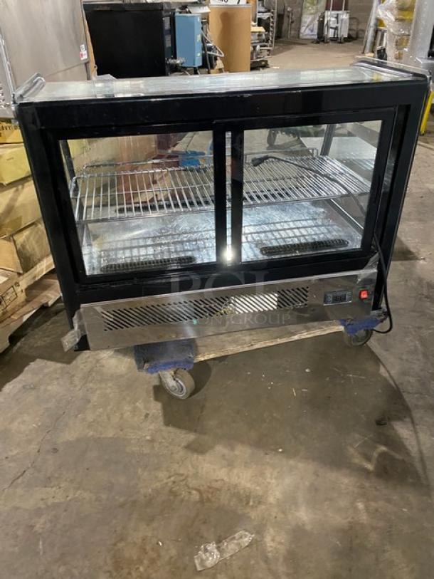 Marchia MDC161 stainless steel 36" curved glass refrigerated bakery display case with adjustable rack, LED lighting, and rear-access sliding doors.