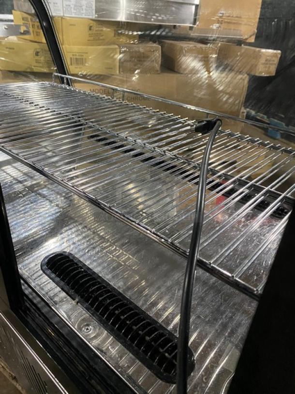 Marchia MDC161 refrigerated display case with adjustable chrome rack, LED lighting, rear-access glass doors. Model SN: 1090808230081.