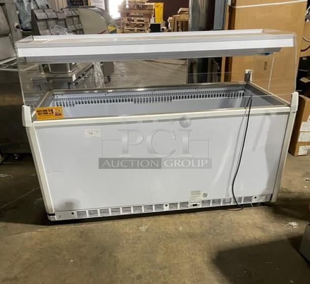 Vendo NIC183S02 white 72" open-air freezer with sneeze guard and LED lighting. Used condition. Serial: 000149903. 220V, 1 phase.