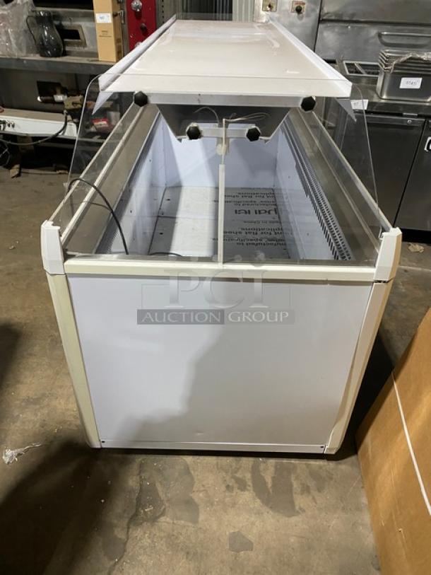 Vendo Commercial 72" white open-air ice cream freezer, model NIC183S02, with sneeze guard and LED lighting, in good condition.