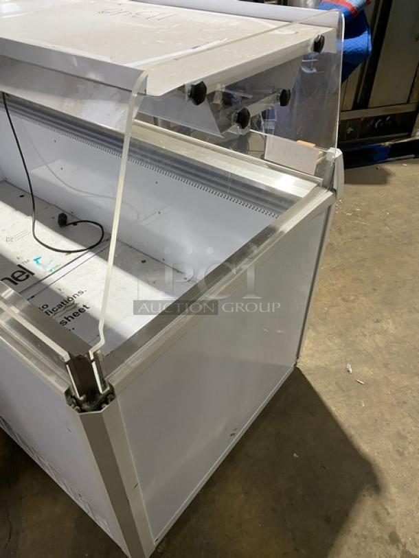 Vendo 72" open-air ice cream merchandiser, Model NIC183S02, with sneeze guard, LED lighting. Good condition, 220V, 1 phase.