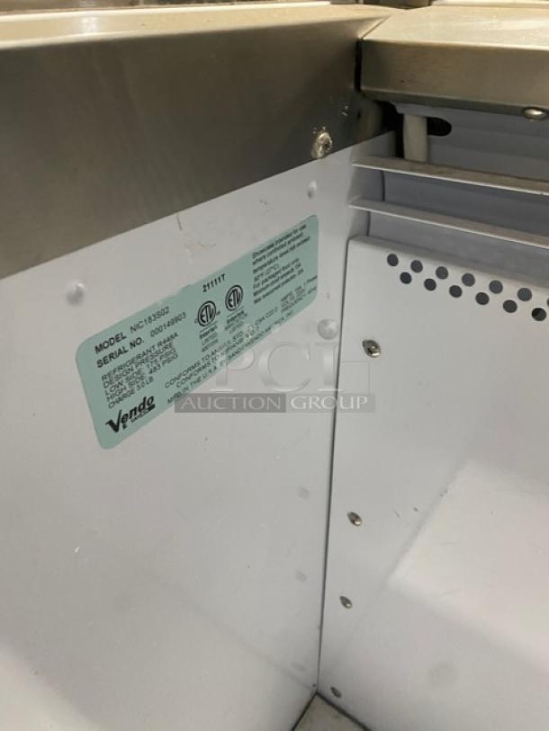 Vendo NIC183S02 commercial ice cream freezer with sneeze guard and LED lighting. Model: NIC183S02, SN: 000149903. 220V, 1 Phase.