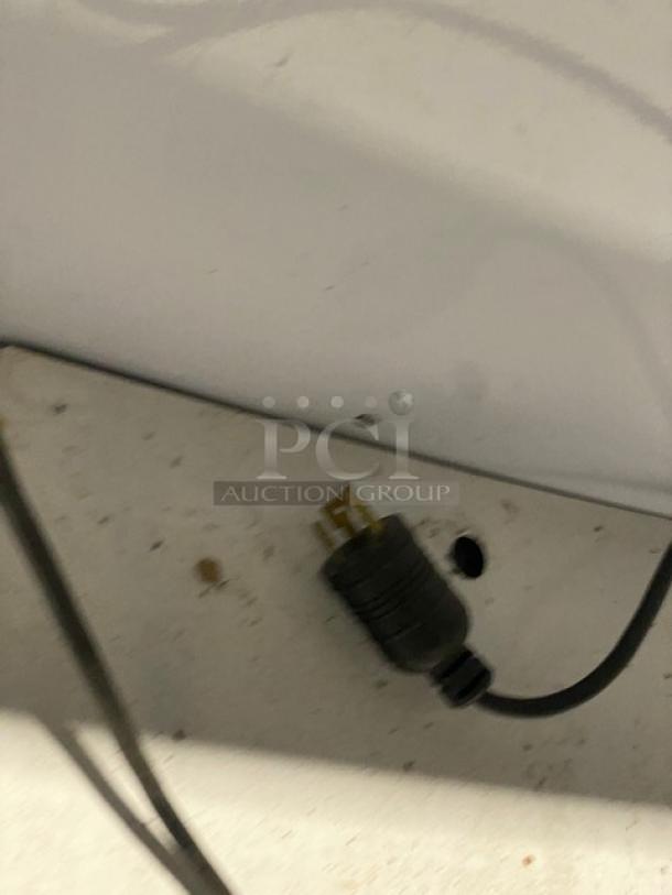 Close-up of a Vendo Model NIC183S02 plug and base. Image shows power connection details for a commercial ice cream freezer.