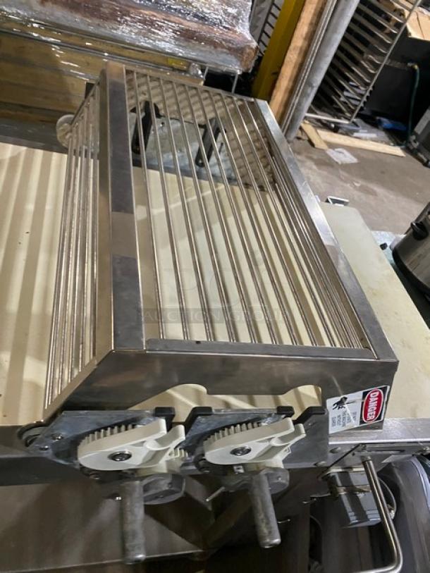 Rondo floor style belt conveyor system, stainless steel, adjustable controls, branded markings, used condition.