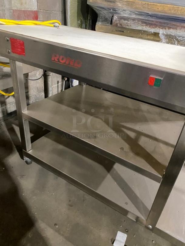 Rondo floor-style belt conveyor system, stainless steel, dual-shelf design, push-button controls, and visible branding.